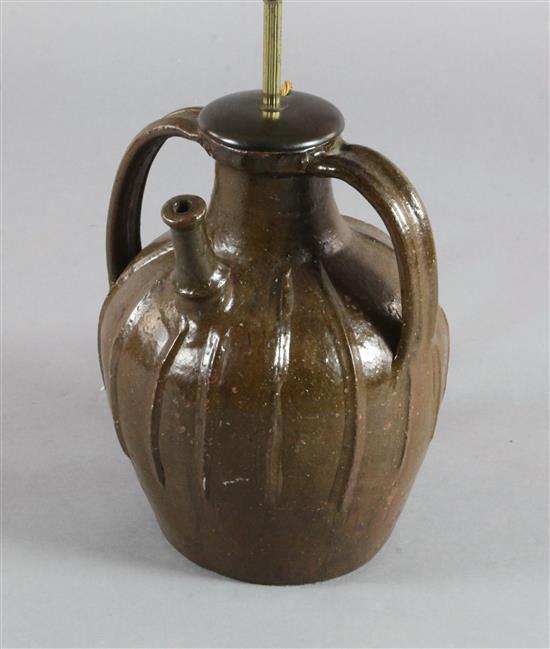A French medieval brown spouted jar, 13.5in.